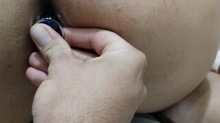 Putting butt plug in the ass of the naughty amateur brunette and masturbating her tight pussy - porn video